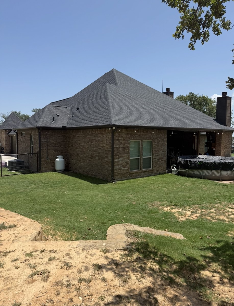 Completed Hip Roof On A Brick Home