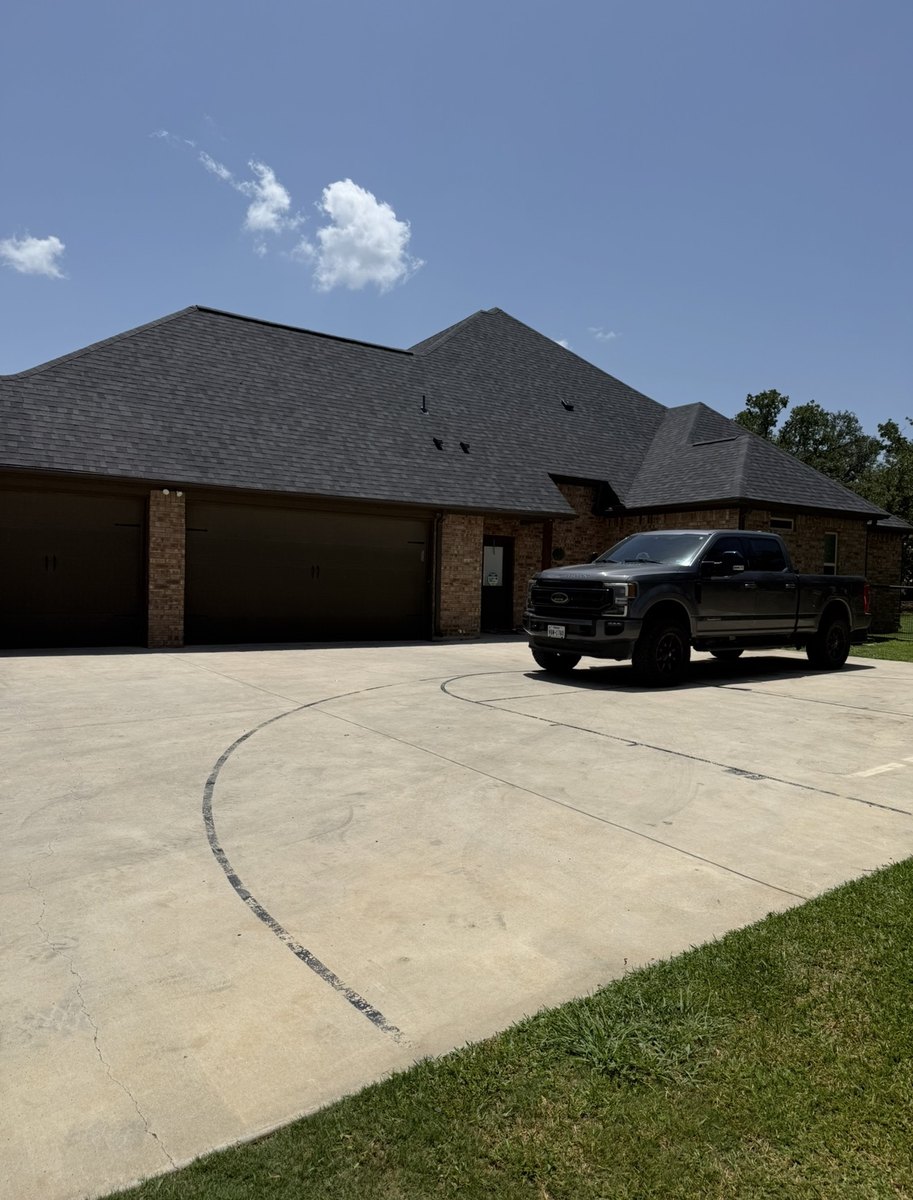 Completed Roof With The Crew Truck In The Driveway