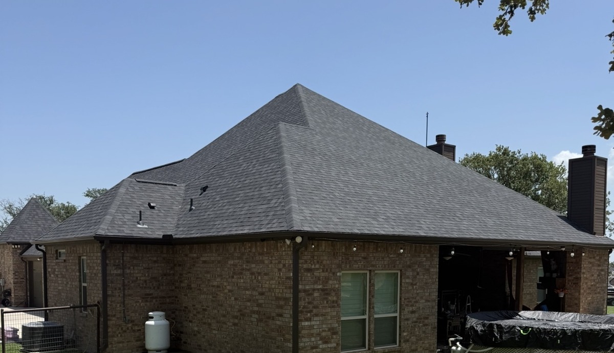 Completed Hip Roof On A Brick Home